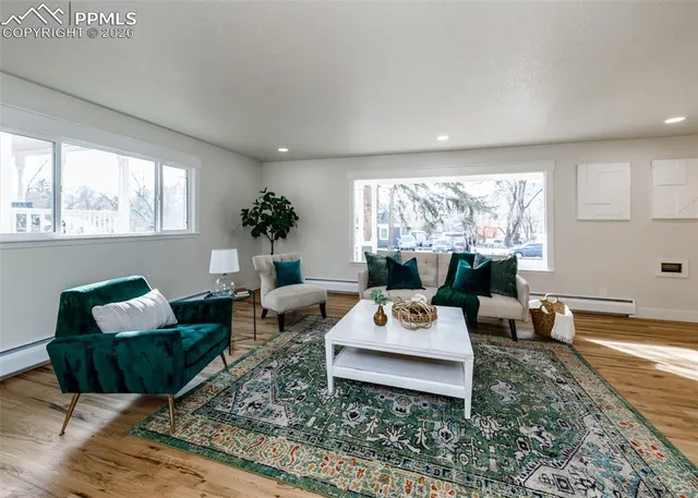 a living room with furniture and a large window
