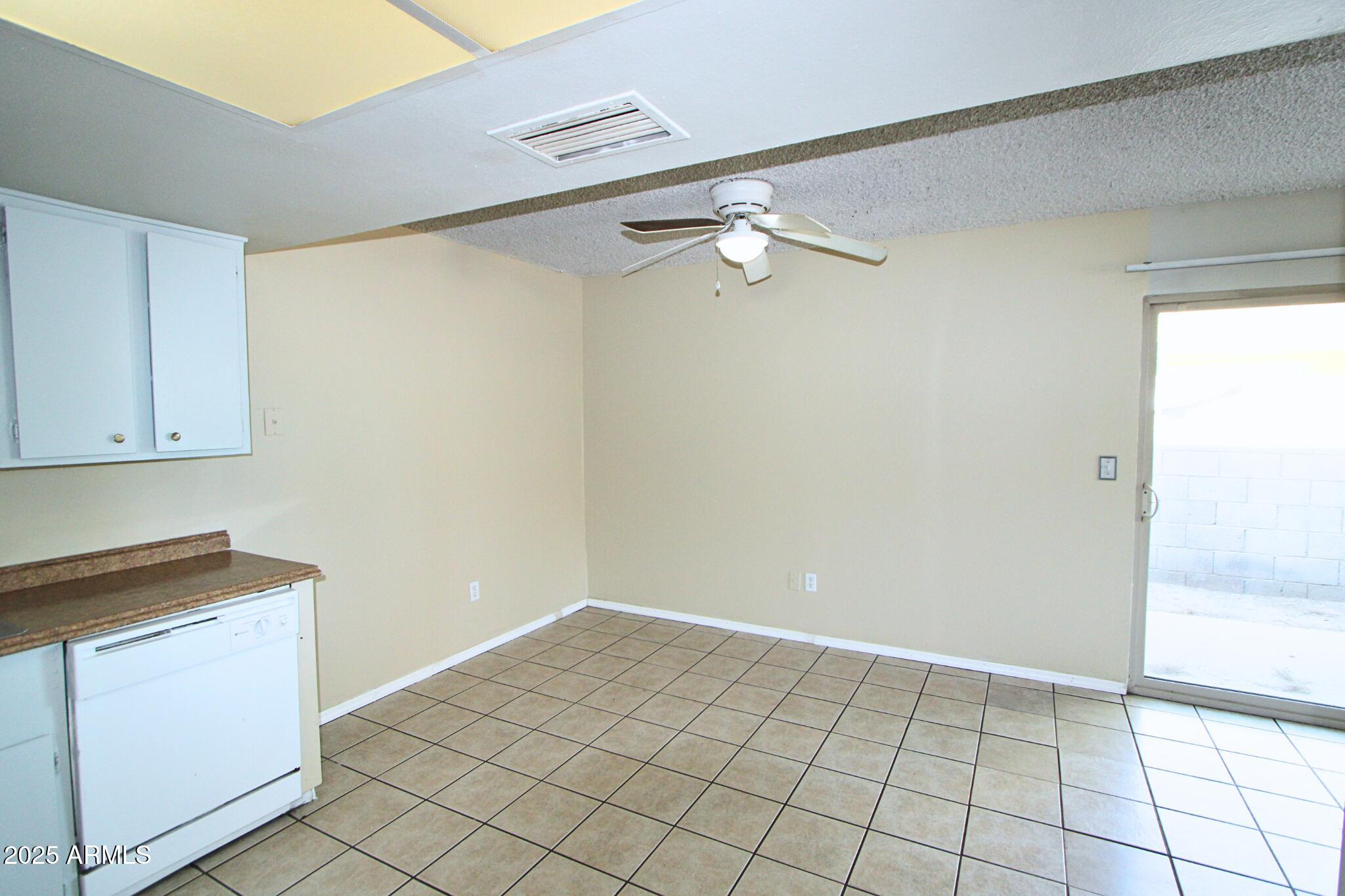 3313 West Harmont Drive, Unit 1 Phoenix, AZ 85051 - Photo 6 of 16 a view of an empty room
