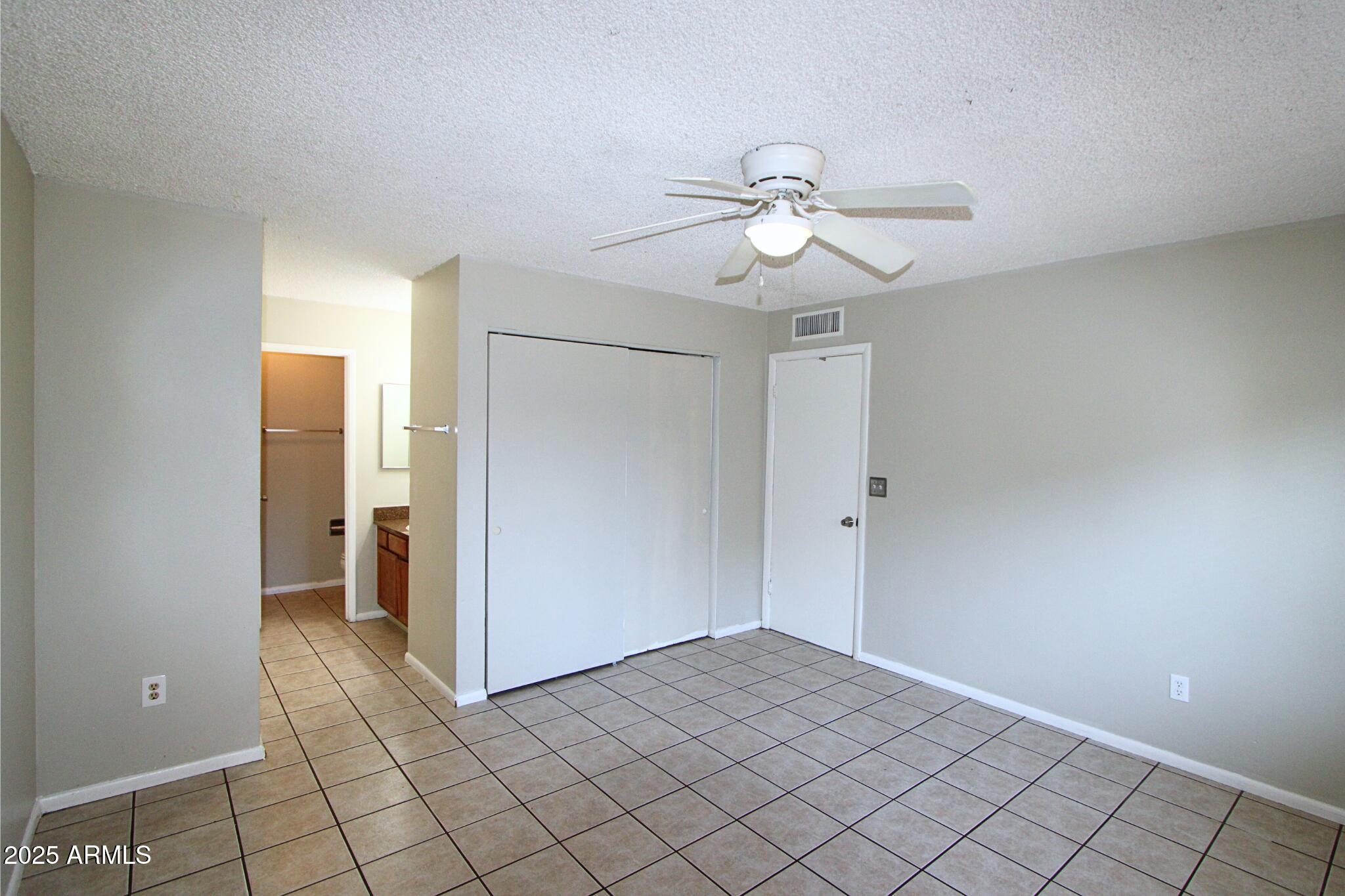 3313 West Harmont Drive, Unit 1 Phoenix, AZ 85051 - Photo 9 of 16 a view of an empty room