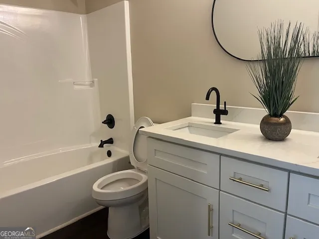 a bathroom with a sink a toilet and a bathtub