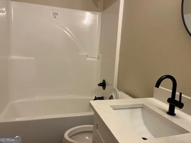a bathroom with a sink a toilet and a bathtub