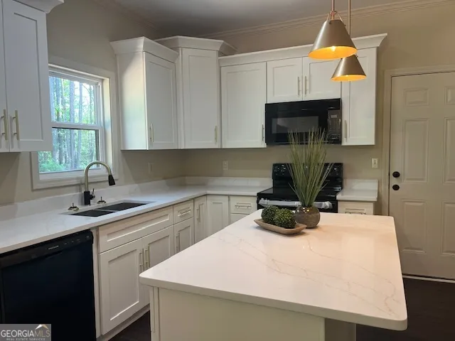 a kitchen with a sink and cabinets