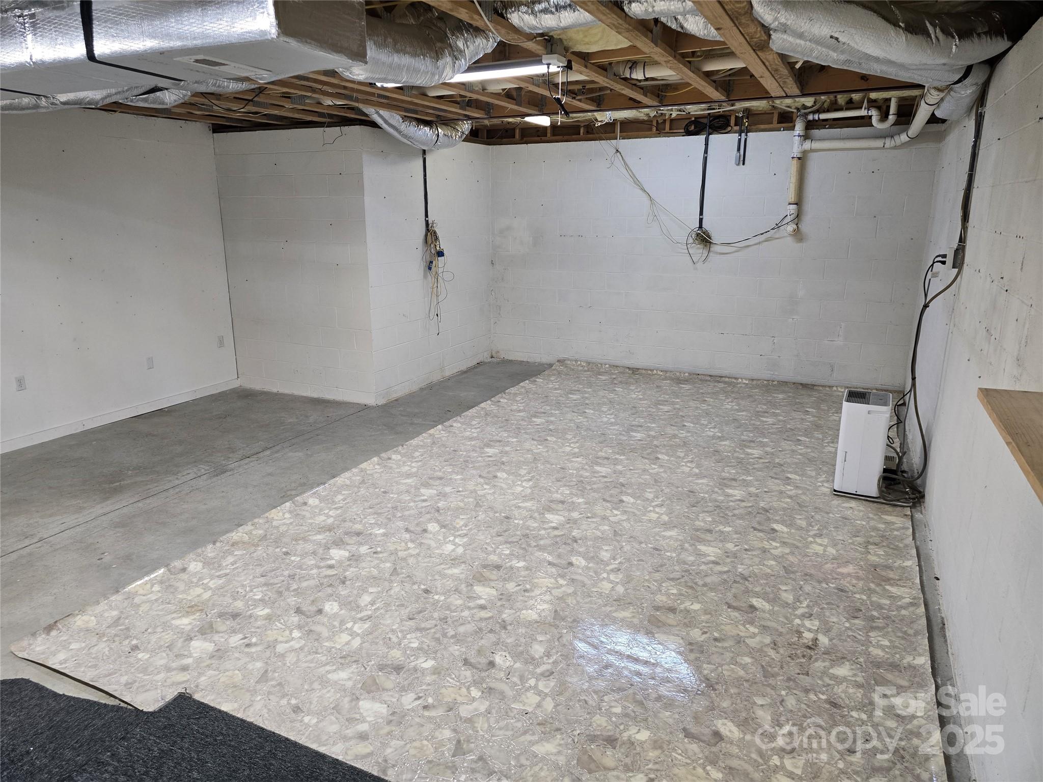 462 Cress Loop Road Salisbury, NC 28147 - Photo 31 of 48 a view of a room with racks on the wall