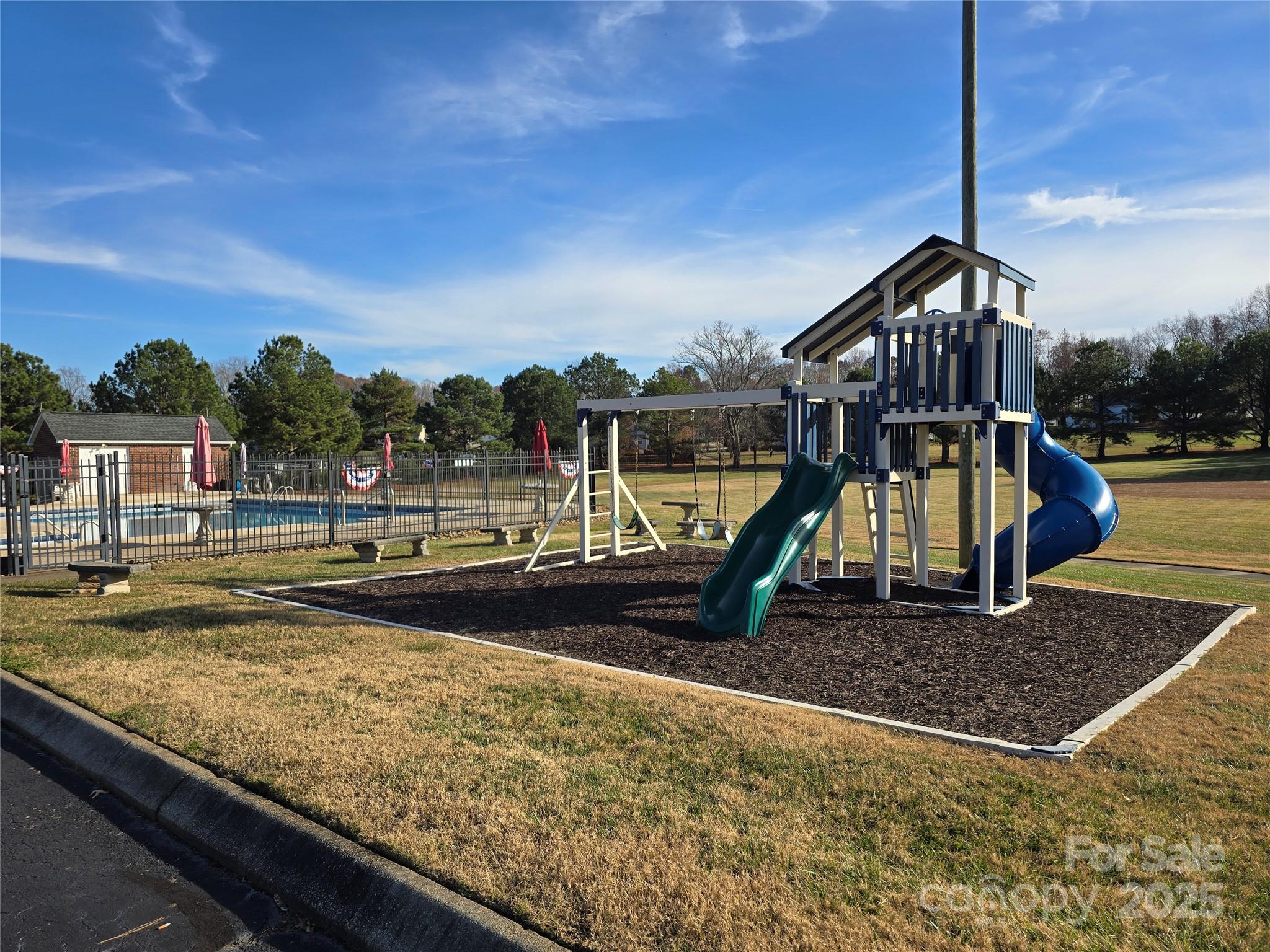 462 Cress Loop Road Salisbury, NC 28147 - Photo 46 of 48 a view of a swimming pool with a patio and a yard