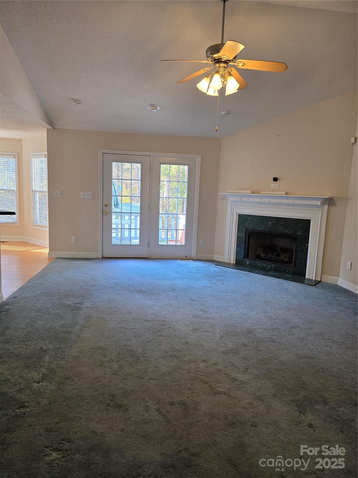 462 Cress Loop Road Salisbury, NC 28147 - Photo 6 of 48 an empty room with windows and fireplace