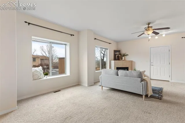 a living room with furniture and a window