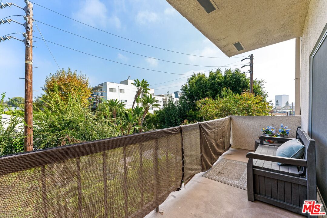 612 South Barrington Avenue, Unit 317 Los Angeles, CA 90049 - Photo 16 of 17 a view of balcony with furniture