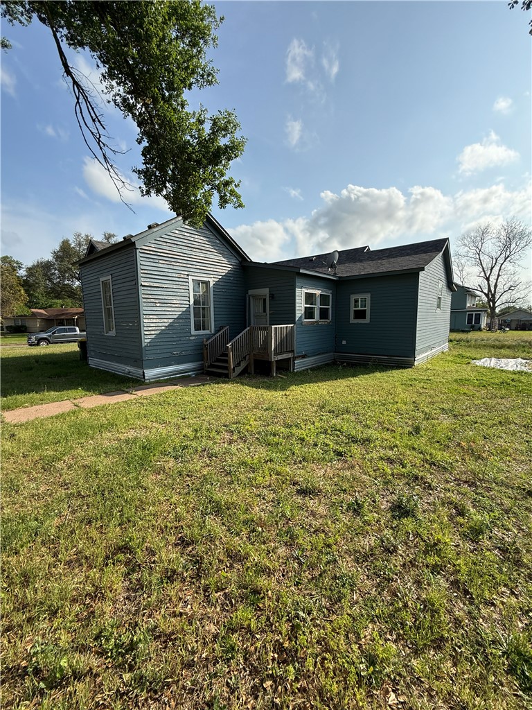 507 Logan Street Calvert, TX 77837 - Photo 18 of 19 a view of a house with a yard