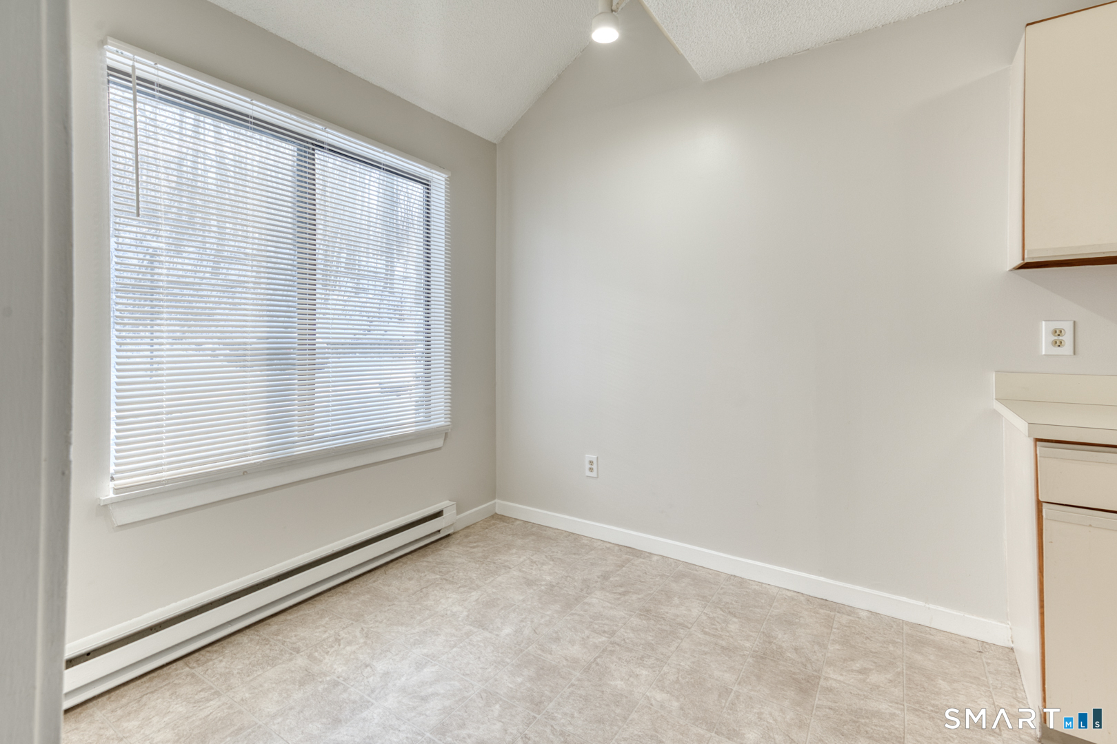 35 Riveredge Drive, Unit 35 Winsted, CT 06098 - Photo 17 of 33 a view of an empty room with a window