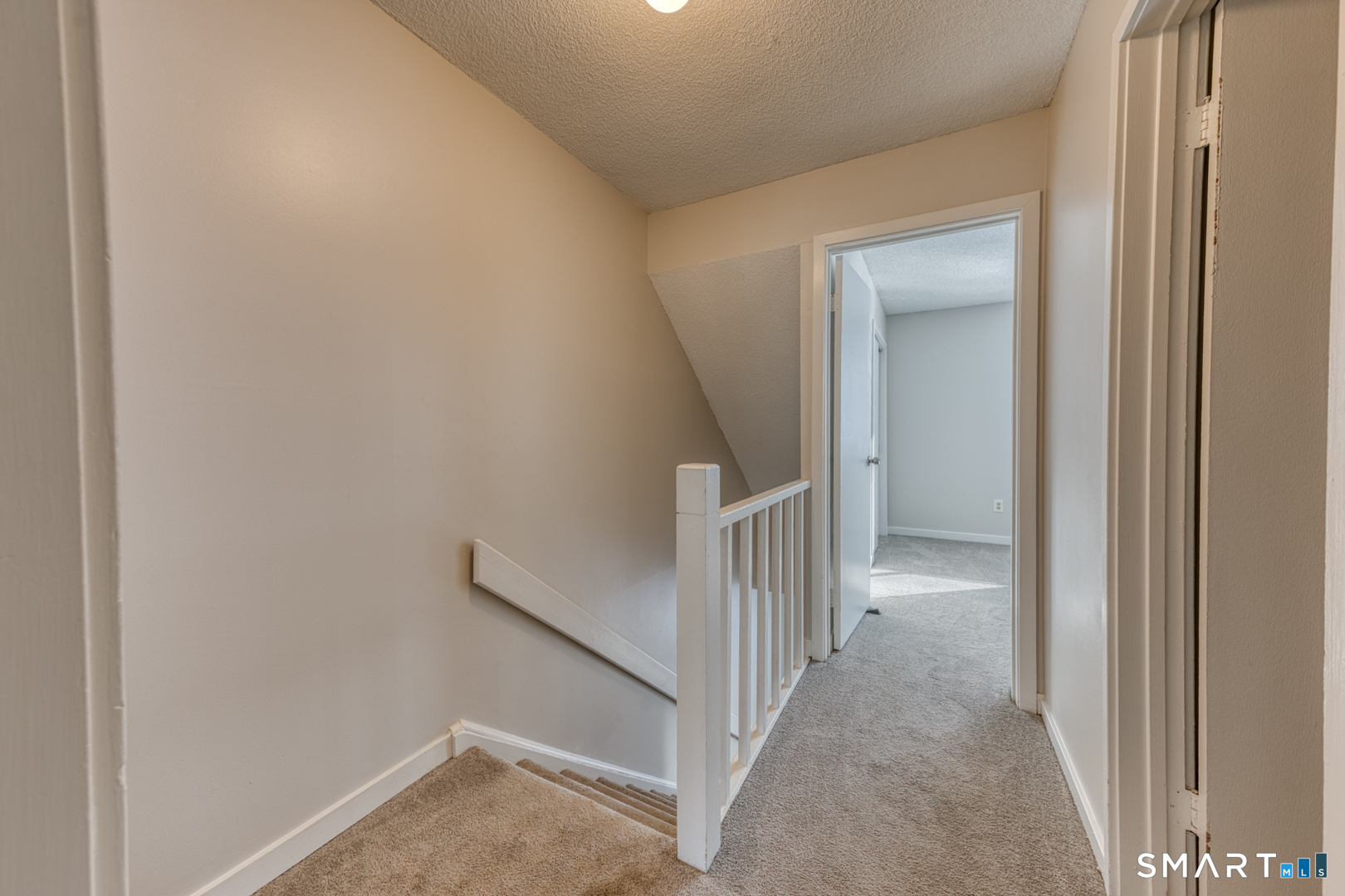 35 Riveredge Drive, Unit 35 Winsted, CT 06098 - Photo 20 of 33 a view of a hallway with a room