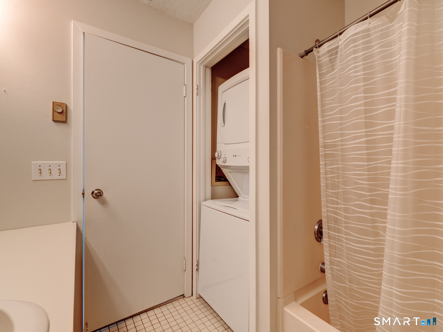 35 Riveredge Drive, Unit 35 Winsted, CT 06098 - Photo 25 of 33 a bathroom with a bathtub and a shower