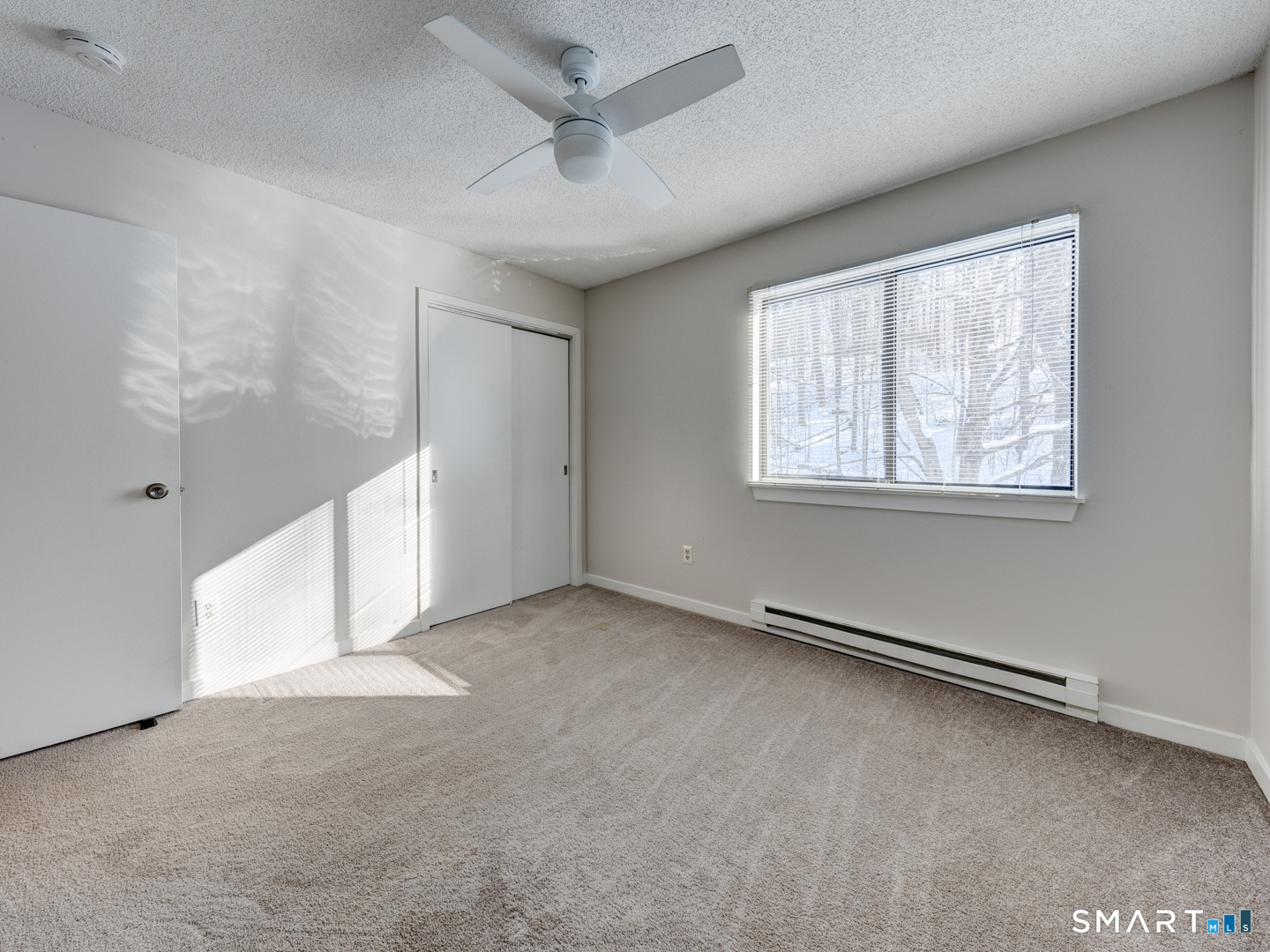 35 Riveredge Drive, Unit 35 Winsted, CT 06098 - Photo 28 of 33 a view of an empty room with a window