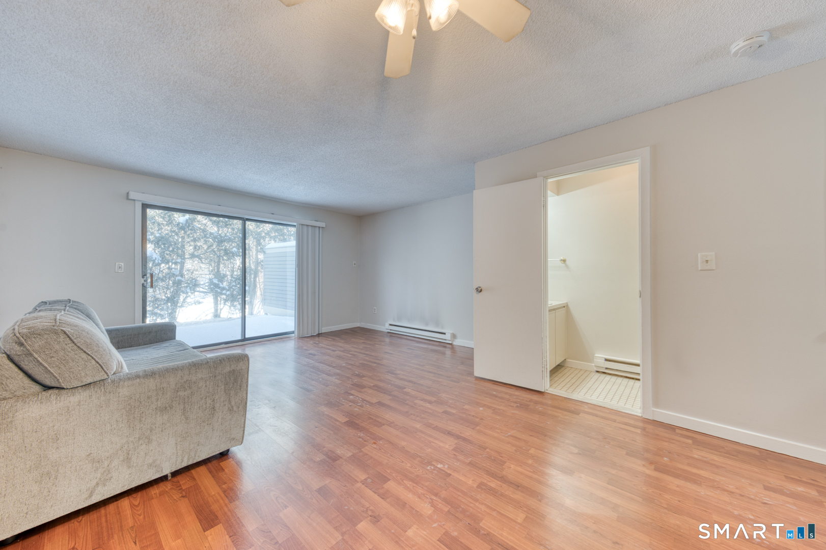 35 Riveredge Drive, Unit 35 Winsted, CT 06098 - Photo 7 of 33 a living room with furniture and a large window