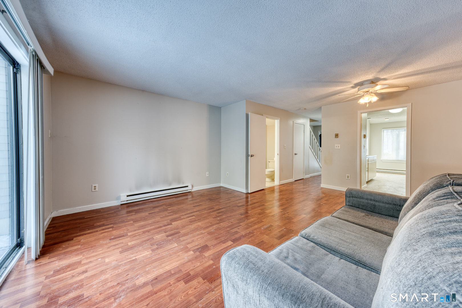35 Riveredge Drive, Unit 35 Winsted, CT 06098 - Photo 8 of 33 a view of livingroom with furniture and wooden floor