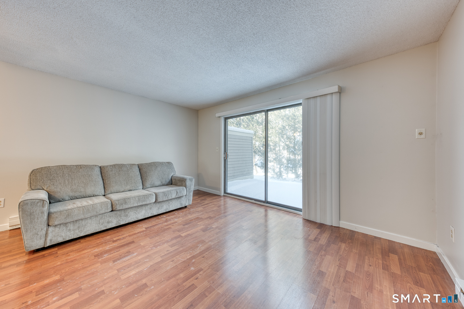 35 Riveredge Drive, Unit 35 Winsted, CT 06098 - Photo 10 of 33 a living room with furniture and a large window