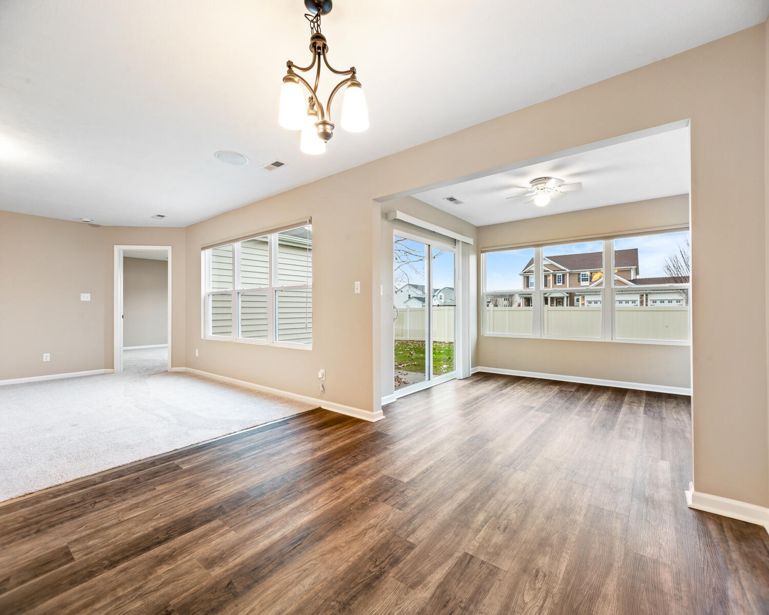 515 East 117th Place Crown Point, IN 46307 - Photo 20 of 35 a view of an empty room with a window and wooden floor