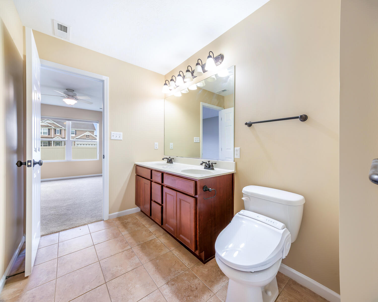 515 East 117th Place Crown Point, IN 46307 - Photo 32 of 35 a bathroom with a granite countertop toilet sink and mirror