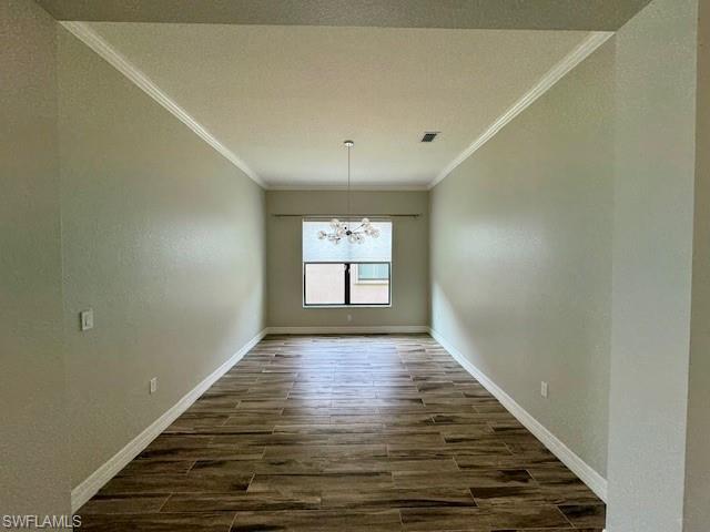 2820 Cinnamon Bay Circle Naples, FL 34119 - Photo 17 of 27 wooden floor in an empty room with window