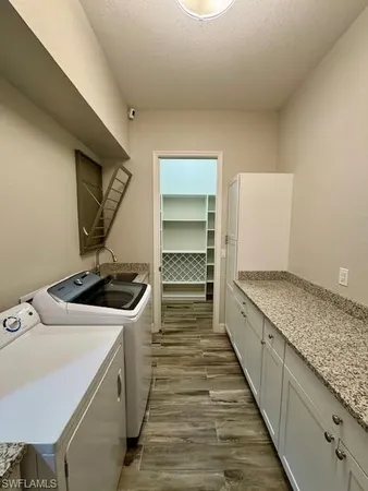 a kitchen with a stove and a sink