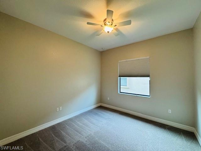 2820 Cinnamon Bay Circle Naples, FL 34119 - Photo 23 of 27 an empty room with a window and a fan