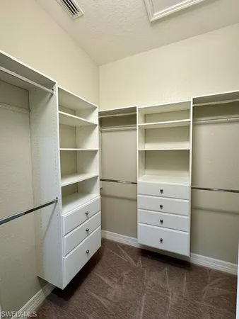 a view of an empty walk in closet