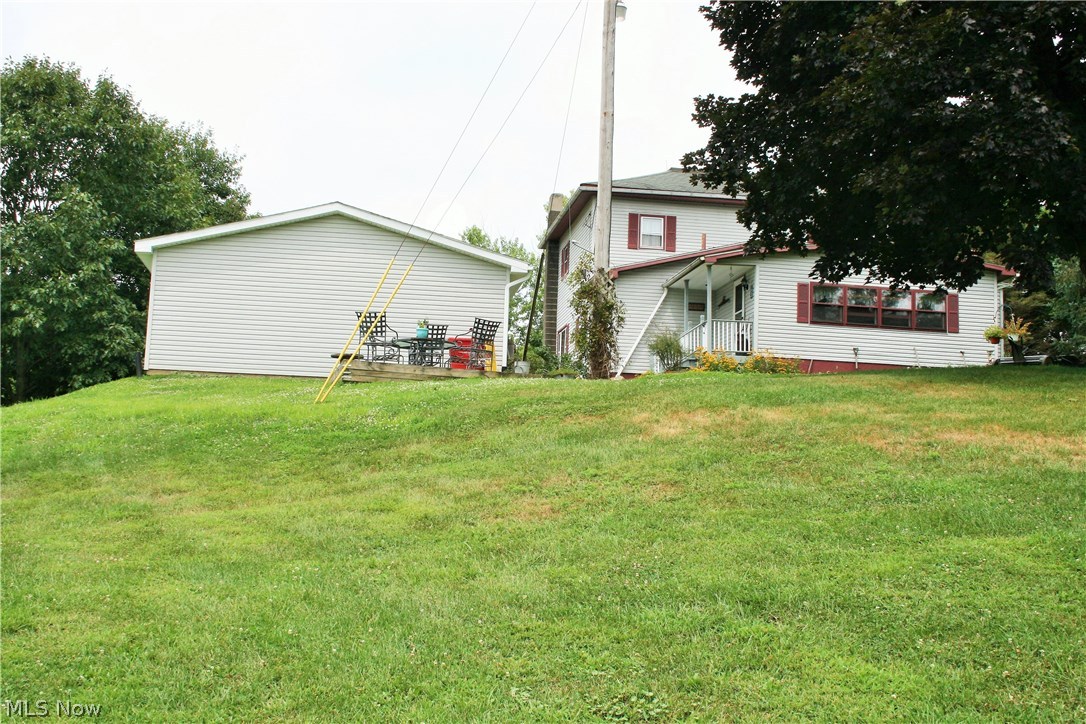 4226 Mayham Road Northeast Carrollton, OH 44615 - Photo 20 of 23 Back view of garage and house