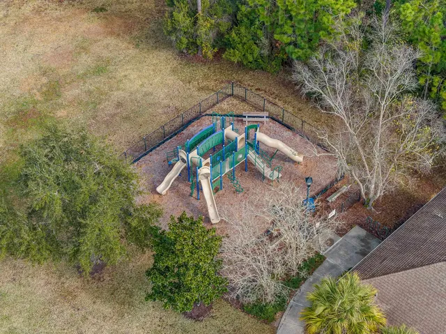 an aerial view of a house with a swimming pool