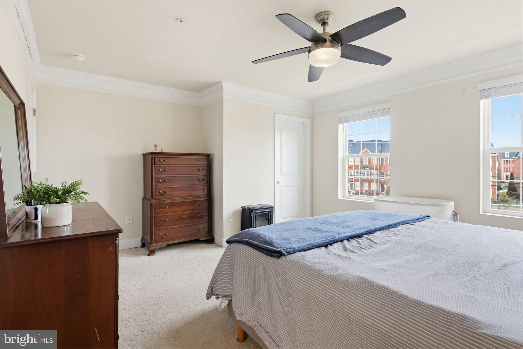5057 East Joppa Road Perry Hall, MD 21128 - Photo 13 of 29 a bedroom with a bed and a potted plant