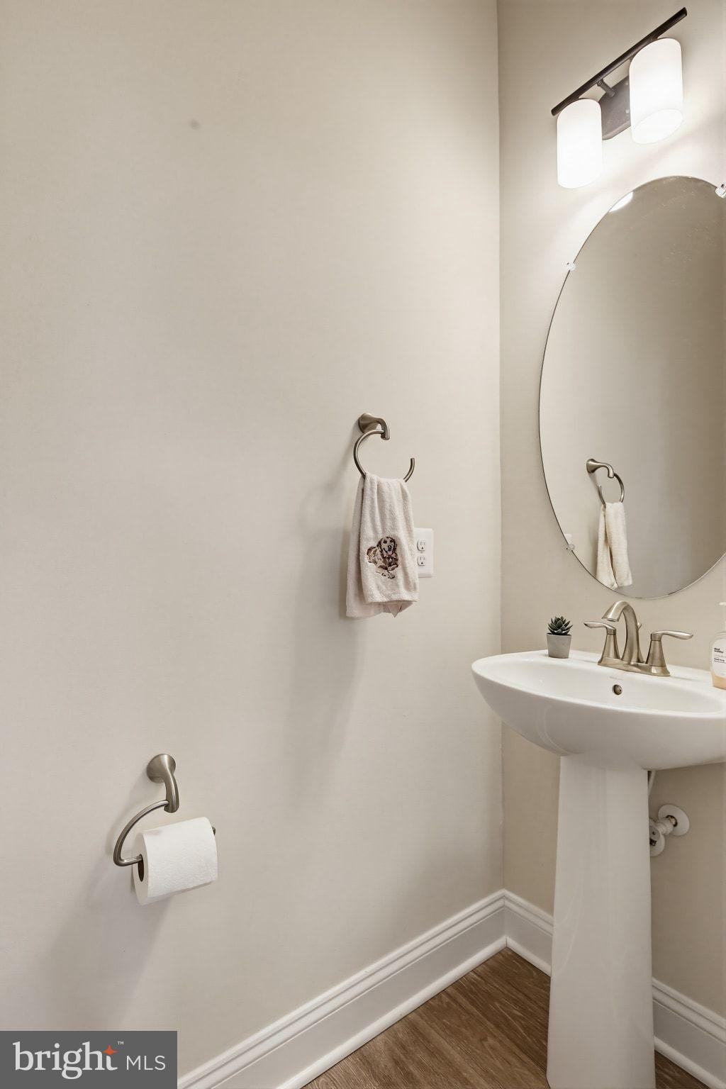 5057 East Joppa Road Perry Hall, MD 21128 - Photo 9 of 29 a bathroom with a sink and mirror