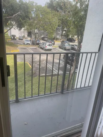 a view of swimming pool from a balcony