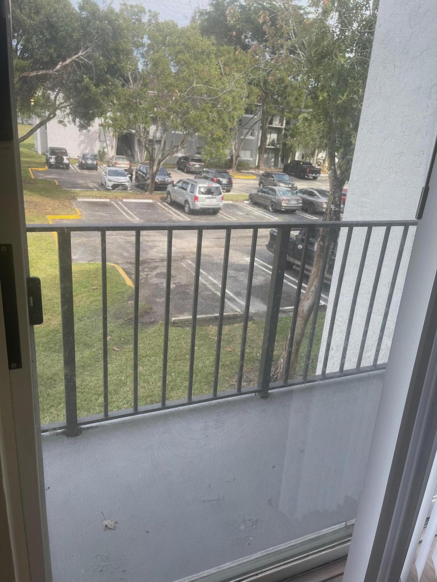 1089 Benoist Farms Road, Unit 207 West Palm Beach, FL 33411 - Photo 16 of 21 a view of lot of windows