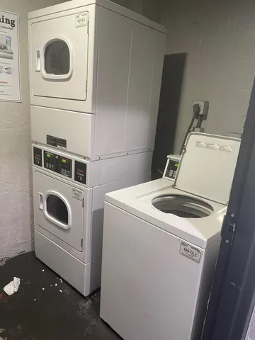 a bathroom with a shower and a sink