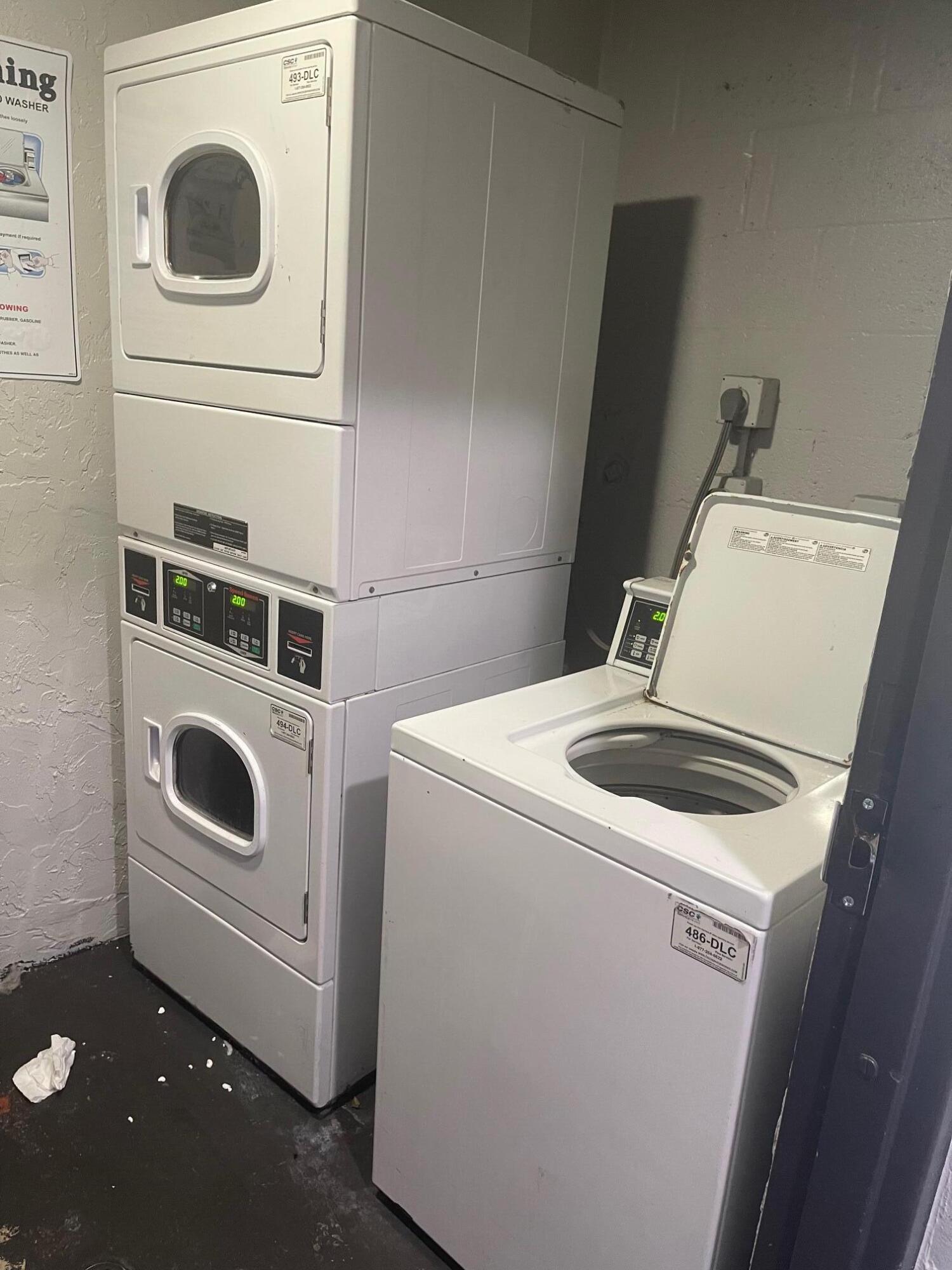 1089 Benoist Farms Road, Unit 207 West Palm Beach, FL 33411 - Photo 20 of 21 a utility room with dryer and washer