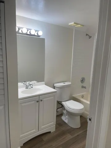 a view of bathroom with a sink and toilet