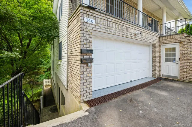 a view of a house with a door and wooden walls