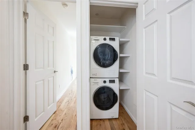 a view of a hallway with washer and dryer
