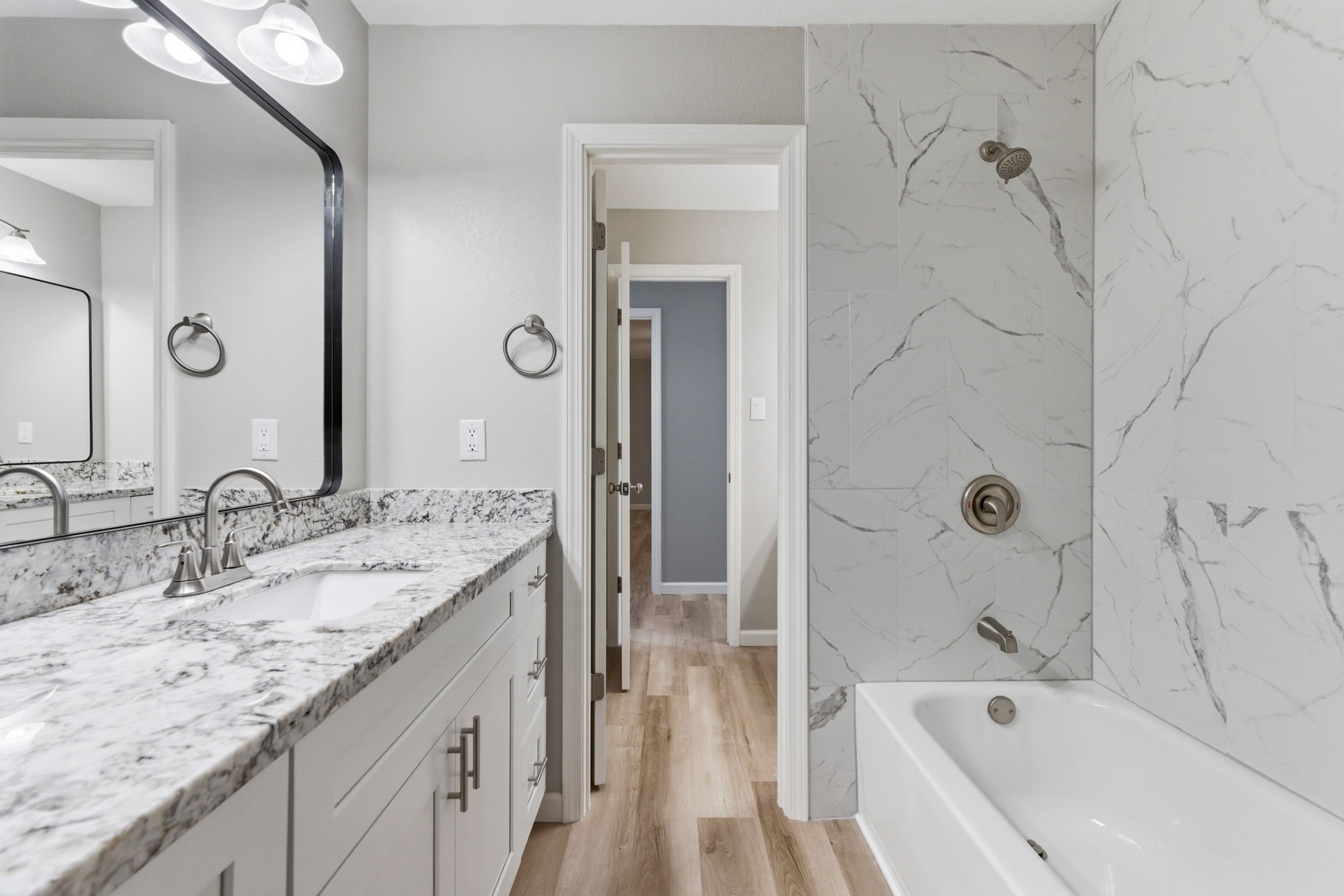 1620 Beachcomber Lane Houston, TX 77062 - Photo 14 of 27 a bathroom with a granite countertop sink tub shower and a mirror
