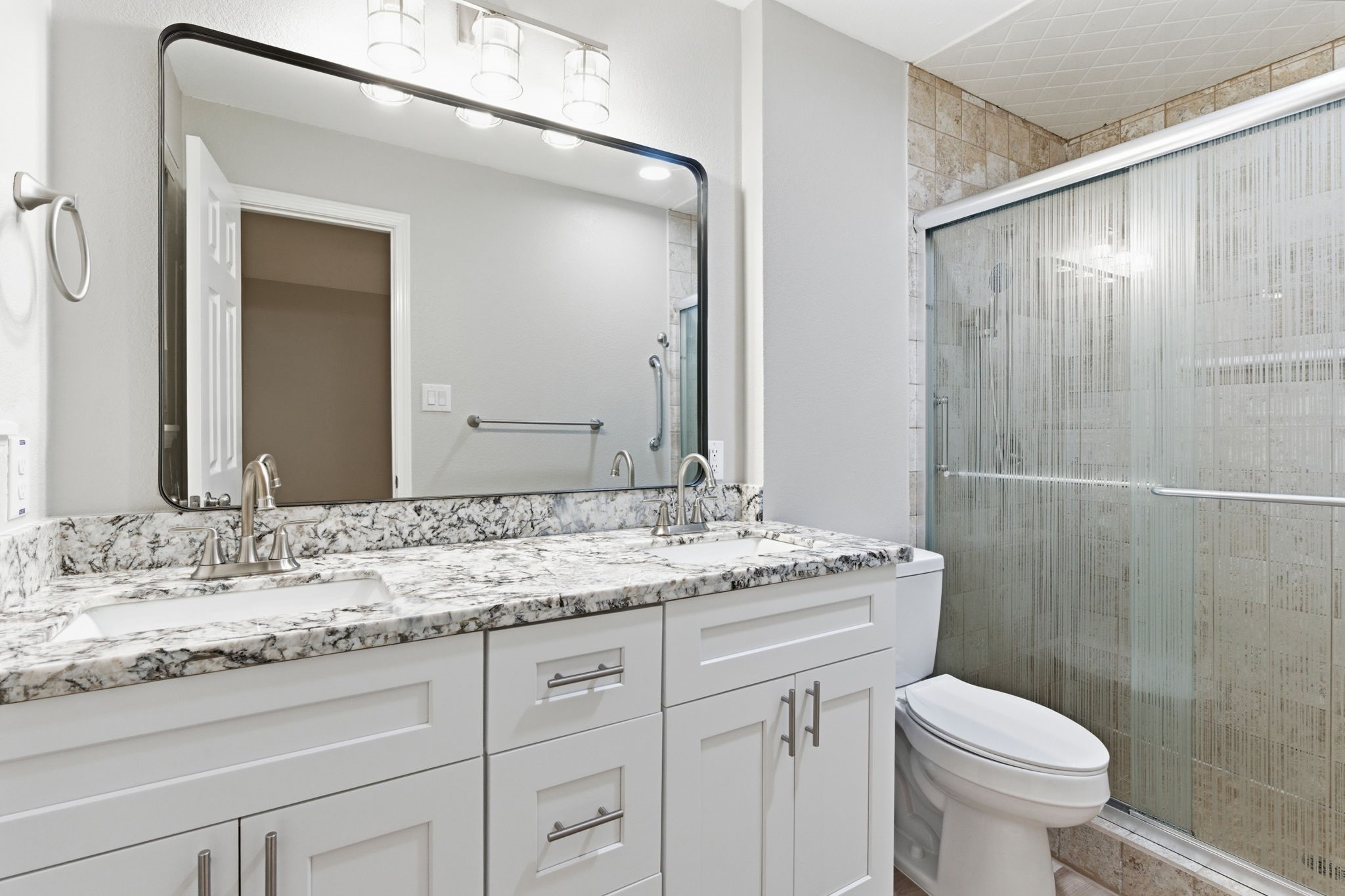 1620 Beachcomber Lane Houston, TX 77062 - Photo 17 of 27 a bathroom with a granite countertop sink toilet and mirror