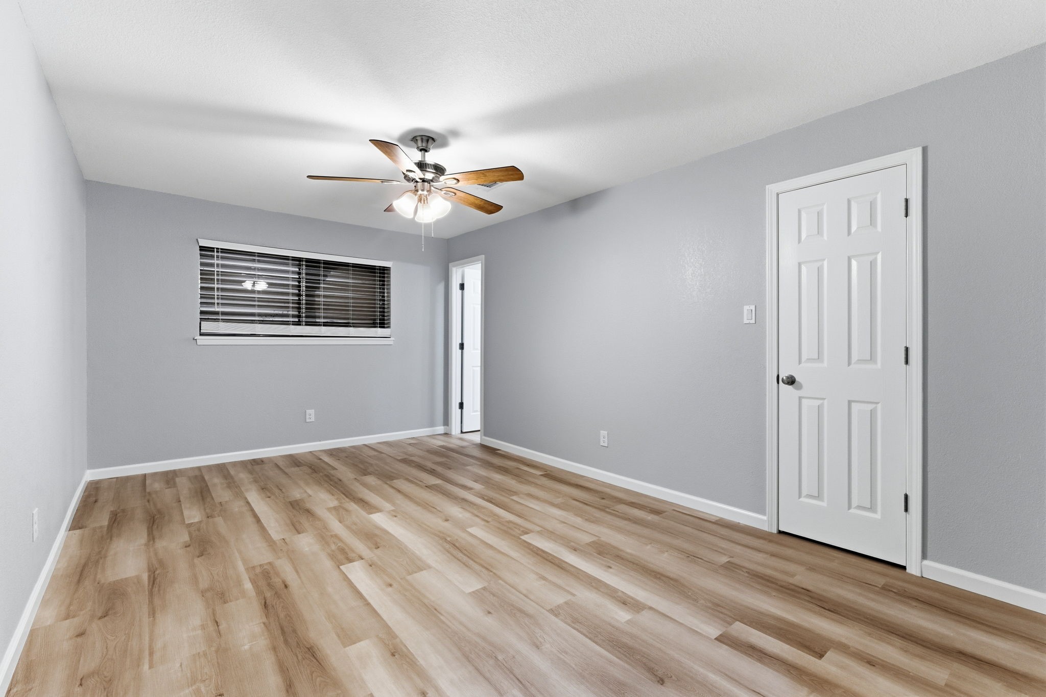 1620 Beachcomber Lane Houston, TX 77062 - Photo 18 of 27 a view of empty room with wooden floor and fan