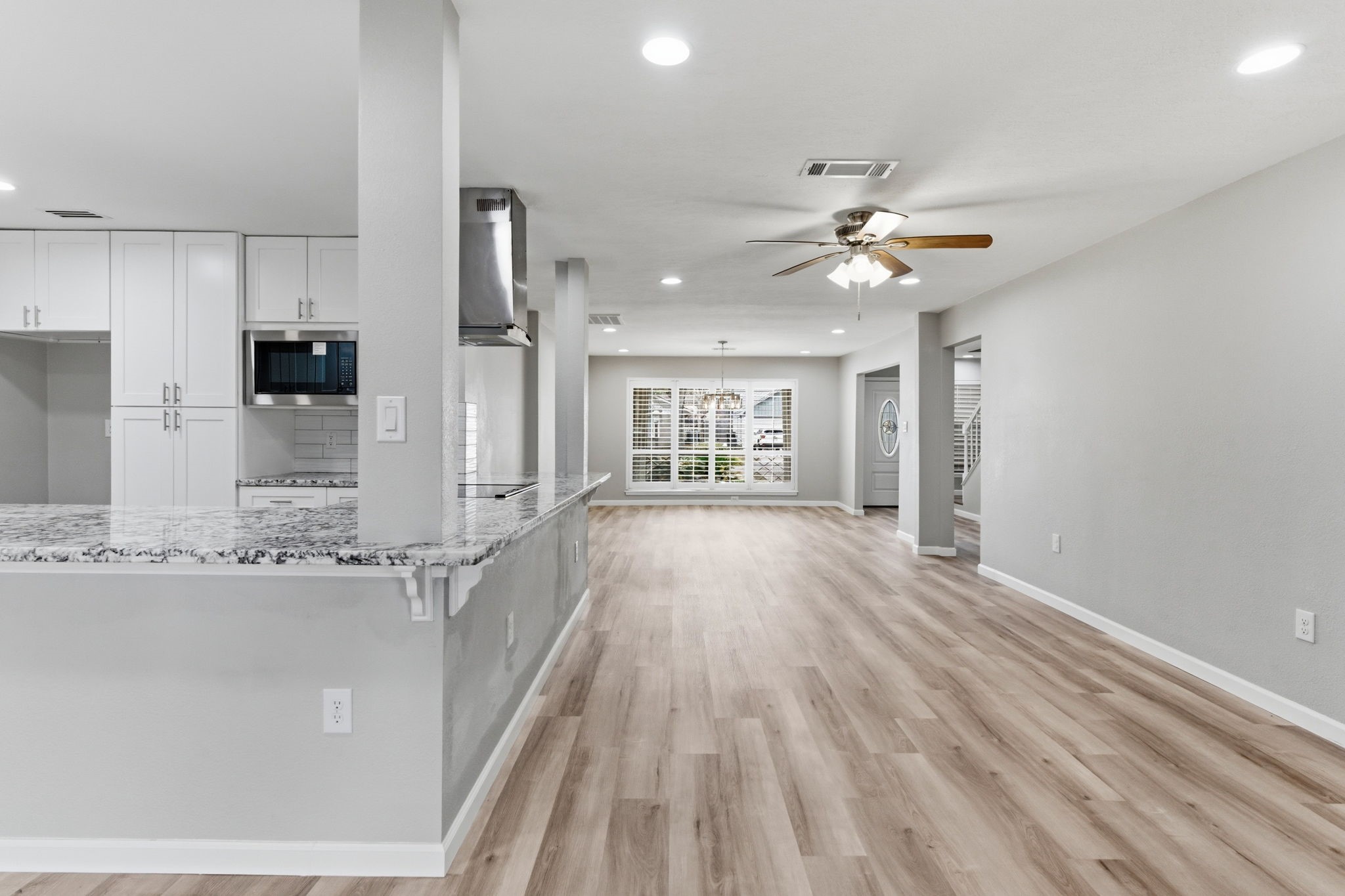 1620 Beachcomber Lane Houston, TX 77062 - Photo 3 of 27 a view of a kitchen with a sink and dishwasher with wooden floor