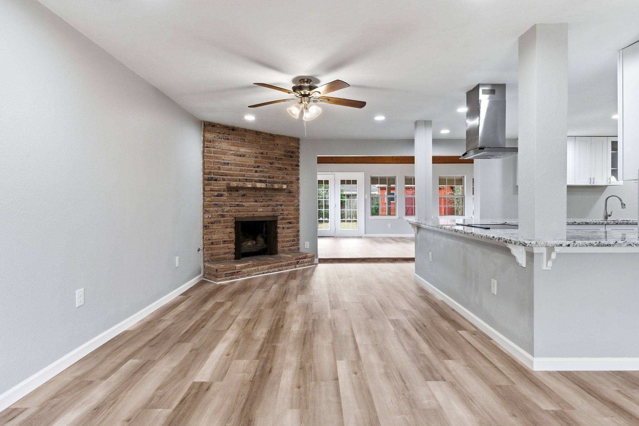 1620 Beachcomber Lane Houston, TX 77062 - Photo 7 of 27 a view of a kitchen with wooden floor and a kitchen