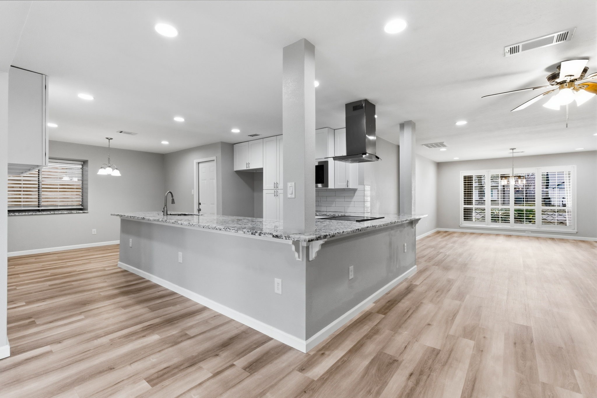 1620 Beachcomber Lane Houston, TX 77062 - Photo 8 of 27 a large kitchen with stainless steel appliances kitchen island a large counter top and a wooden floors