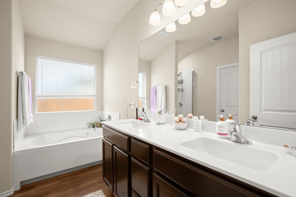 5526 Perdita Drive Belton, TX 76513 - Photo 12 of 23 a bathroom with a tub sink and mirror