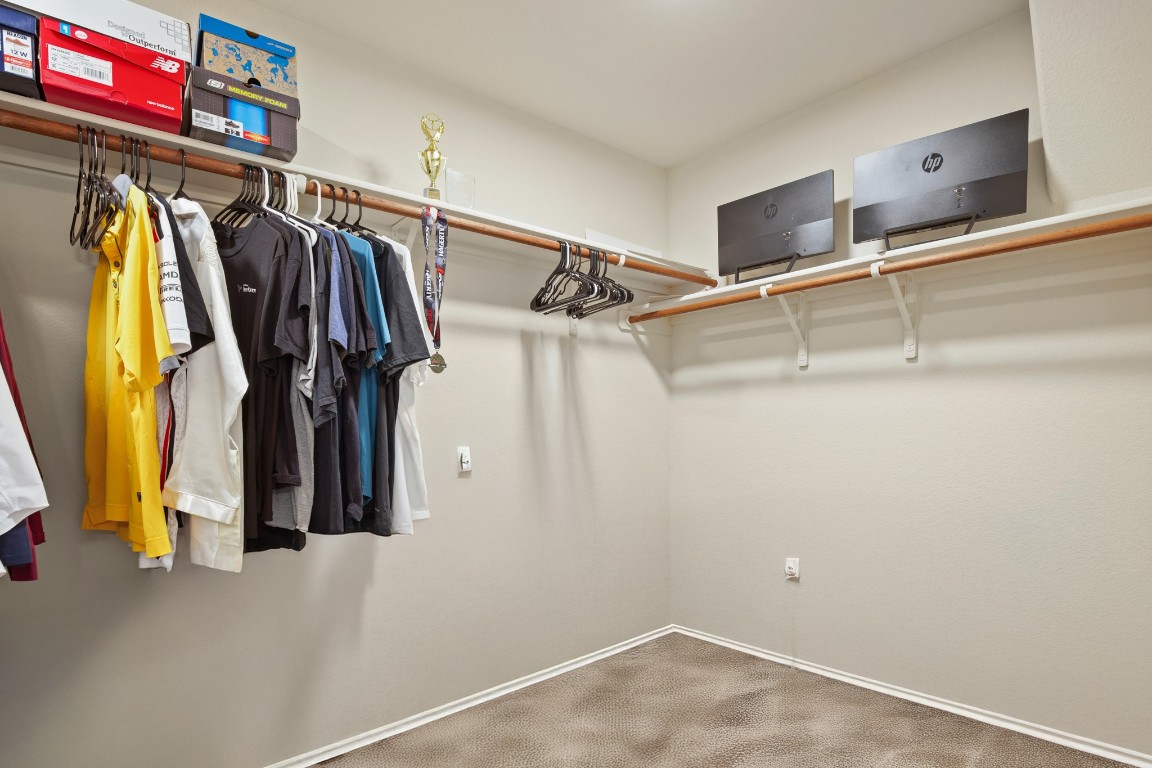 5526 Perdita Drive Belton, TX 76513 - Photo 13 of 23 a view of walk in closet with clothes and shoes