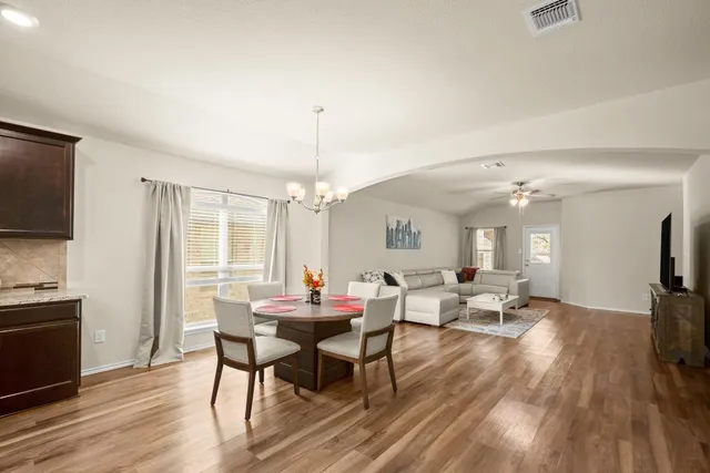 a view of a dining room with furniture window and wooden floor