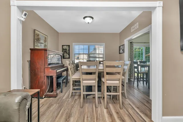a view of a livingroom with furniture and wooden floor