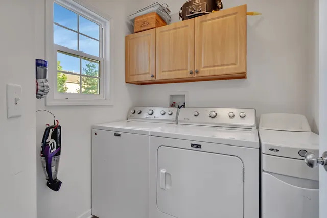 a bathroom with a granite countertop toilet a sink and a mirror
