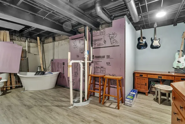 a bedroom with bed and a bookshelf