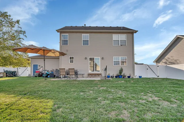 a view of a house with a yard
