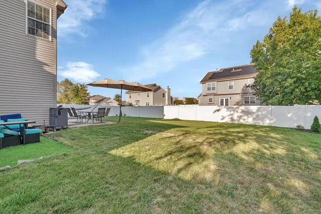 a view of backyard of garage and trees